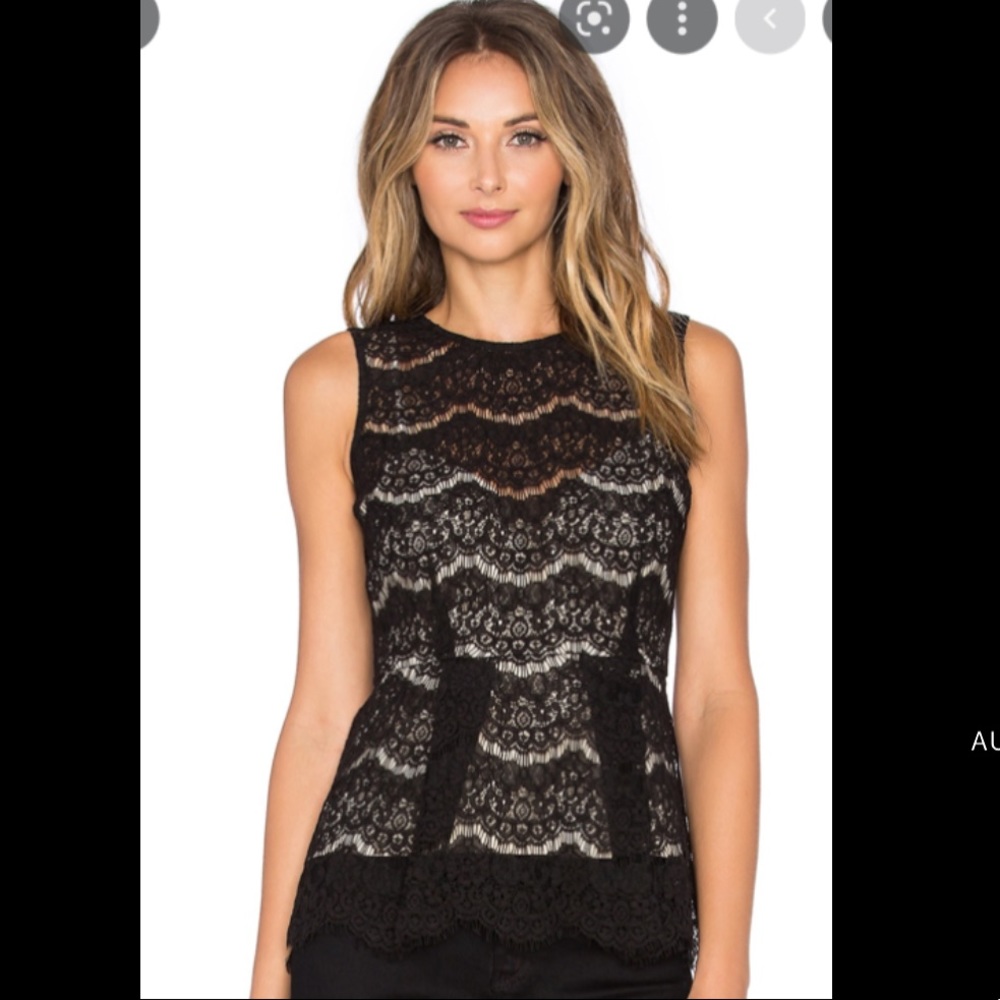 Black lace peplum top by Wayf with nude lace camisole.